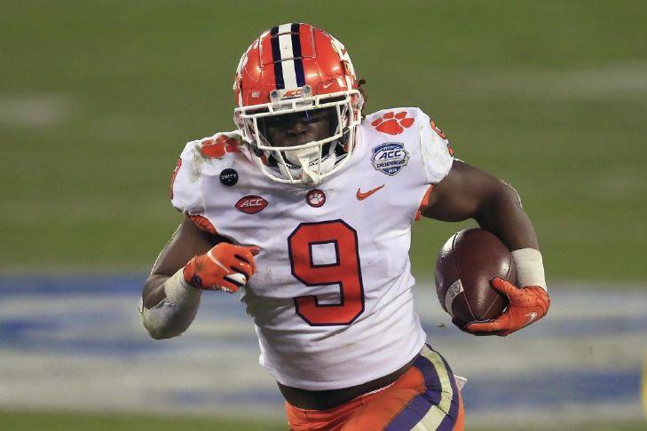 Clemson running back Travis Etienne (9) runs for a touchdown during the first half of the Atlantic Coast Conference championship NCAA college football game against Notre Dame, Saturday, Dec. 19, 2020, in Charlotte, N.C. Etienne was selected to The Associated Press All-America first-team offense, Monday, Dec. 28, 2020.(AP Photo/Brian Blanco)